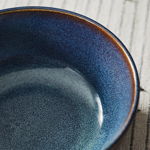 Blue bowl on wood