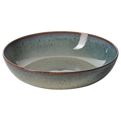 A GLADELIG bowl in greenish-blue with a vintage-inspired, handcrafted look. Its made of stoneware with a reactive glaze, perfect for serving meals.