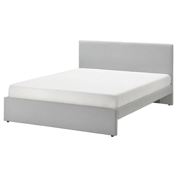 Modern grey upholstered bed with clean lines, padded headboard & textured fabric.