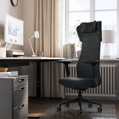 Modern office with tall, ergonomic GRÖNFJÄLL chair at a desk by a window.