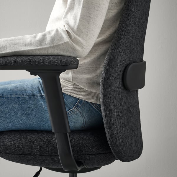 Office chair with adjustable lumbar support and armrests.