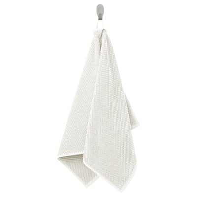 GULVIAL beige cotton towel, soft textured, rectangular, hangs on hook.