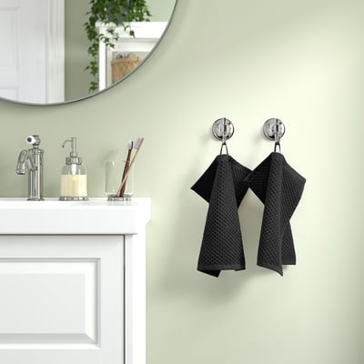 Bathroom with beige towel GULVIAL on hooks. Soft, absorbent, medium-large cotton towel near sink.