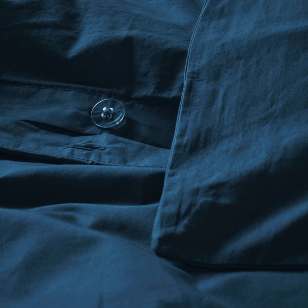 Dark blue duvet cover with button closure, crisp percale cotton.