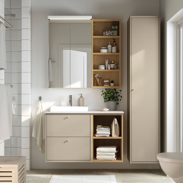 Havbaeck bathroom unit: drawer, shelves with towels, basin, toiletries.
