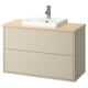 A beige HAVBÄCK bathroom vanity with a bamboo countertop and a white square ceramic sink.