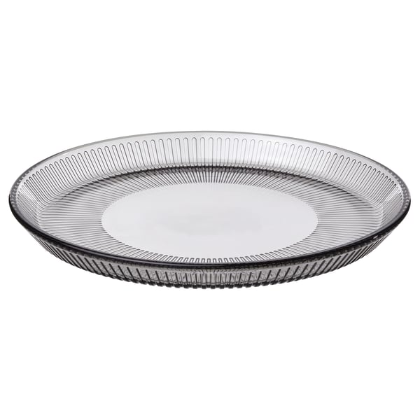 Oval grey glass plate with linear design.