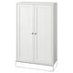 A white HAVSTA wooden cabinet with two doors and knobs. Its rectangular, made of solid pine, and has a rustic design.