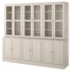 A HAVSTA light gray wooden cabinet with glass doors and solid wood drawers.