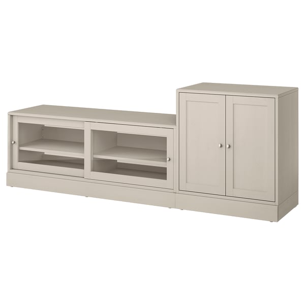 A light beige HAVSTA storage unit with an open shelf and a cabinet for organising and hiding cables.