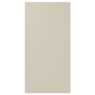 A beige rectangular HAVSTORP cabinet door. It is smooth with clean lines, made of acrylic paint and fibreboard.