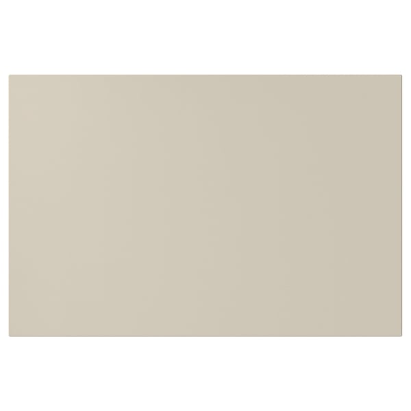 Beige HAVSTORP kitchen cabinet with smooth, rectangular design.