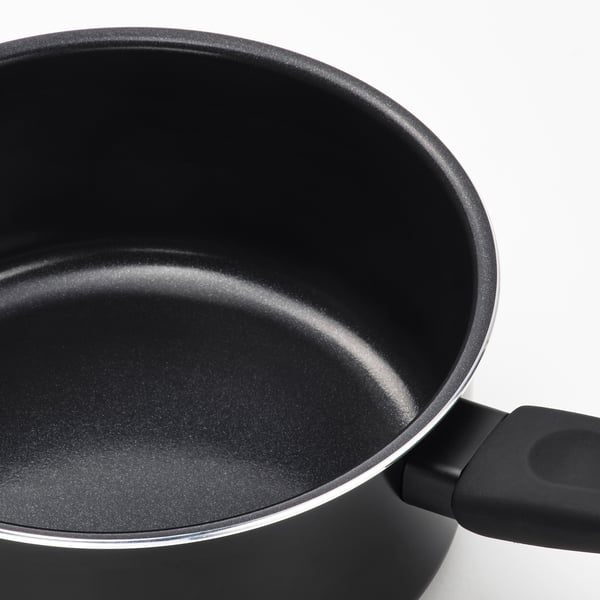 Black non-stick saucepan with comfortable handle; quality material, even heat distribution.