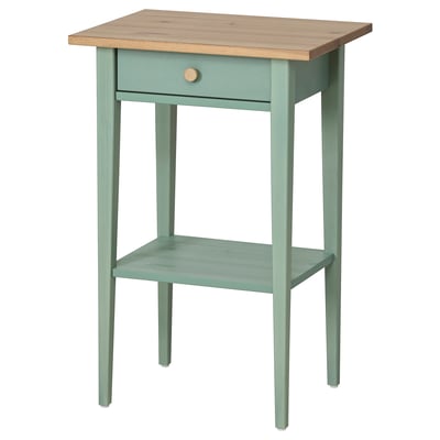 A wooden HEMNES side table in grey-green with a light wood top. It has one drawer and a shelf, offering both storage and display.