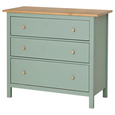 A green HEMNES three-drawer chest with wooden knobs and top.