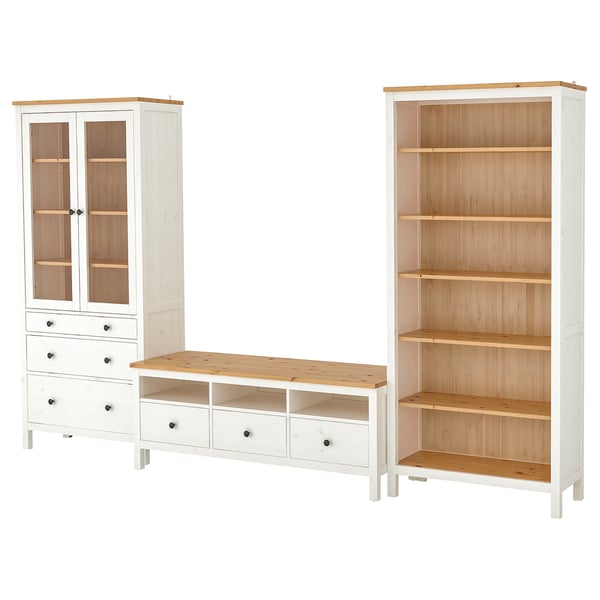 Image HEMNES furniture set: white bookcase, tv bench, and glass-door cabinet with drawers, all made of pine and wood.