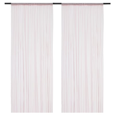 Two light pink curtains with rod pocket hanging, sheer fabric for privacy and daylight.