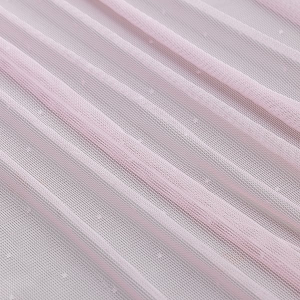 Close-up of sheer, textured light pink curtain fabric, showcasing its delicate, slightly rippled surface.