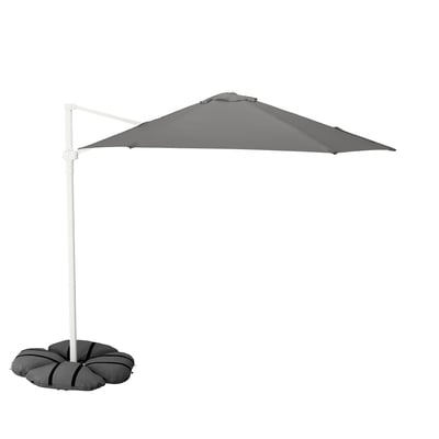 A grey HÖGÖN hanging parasol with a white pole and a sandbag base, designed for outdoor shade.