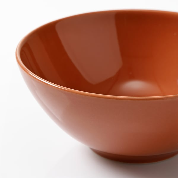 Rustic bowl with smooth, glossy finish; curved sides; sturdy base, ideal for meals.