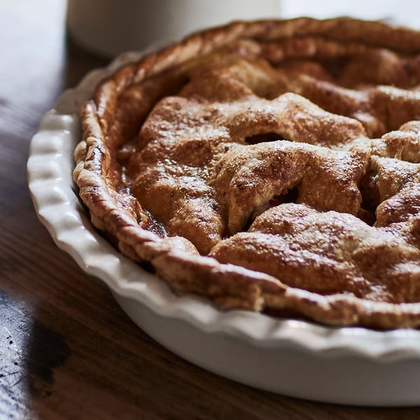 Delicious homemade pie in a sturdy, well-crafted stoneware dish, perfect for serving.