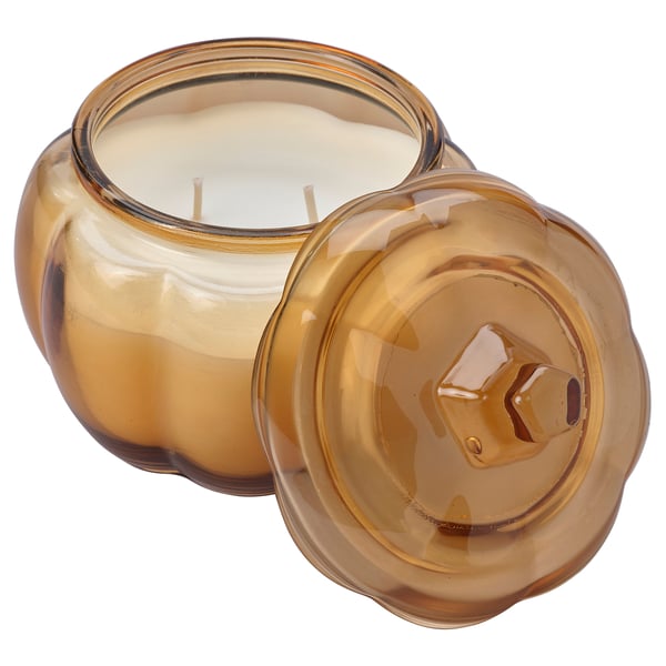 Orange-brown glass candle jar with lid, pumpkin-shaped, contains triple-wick candle. Part of HÖSTAGILLE series.