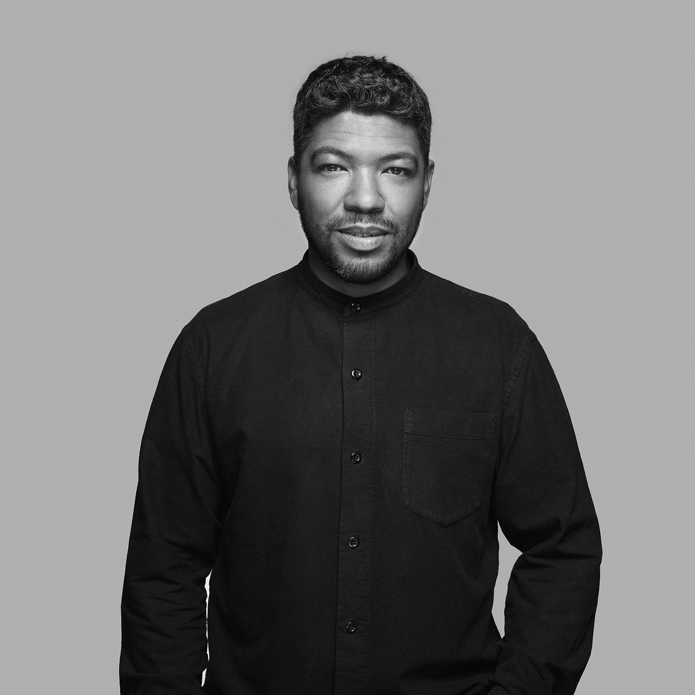 Black and white portrait of James Dart in a dark shirt.