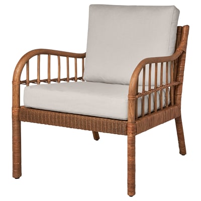 The HOLMSTA armchair in natural rattan and wood with grey cushions. It has a curved back and armrests, offering a comfortable and decorative design.