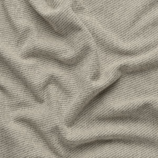 Close-up of a soft, textured fabric with subtle patterns, likely a sofa or curtain material, showcasing its fine texture and quality weave.