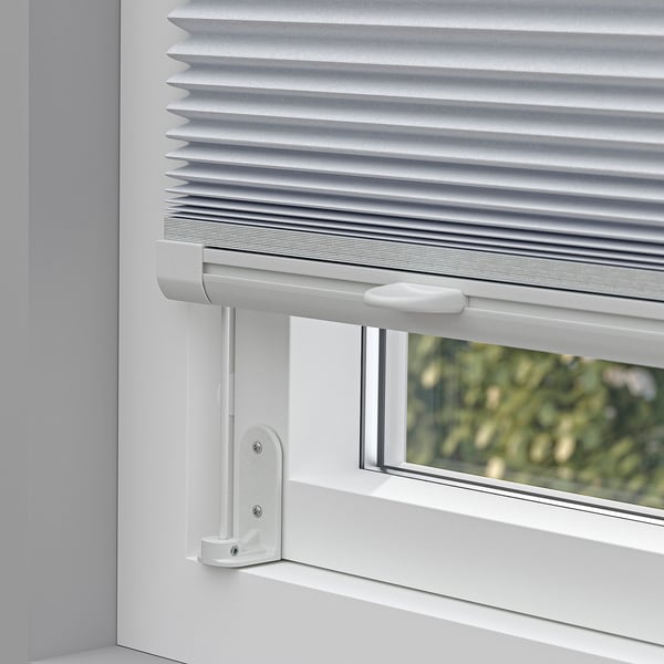 Window blind partially drawn, showing light block and adjustable height.