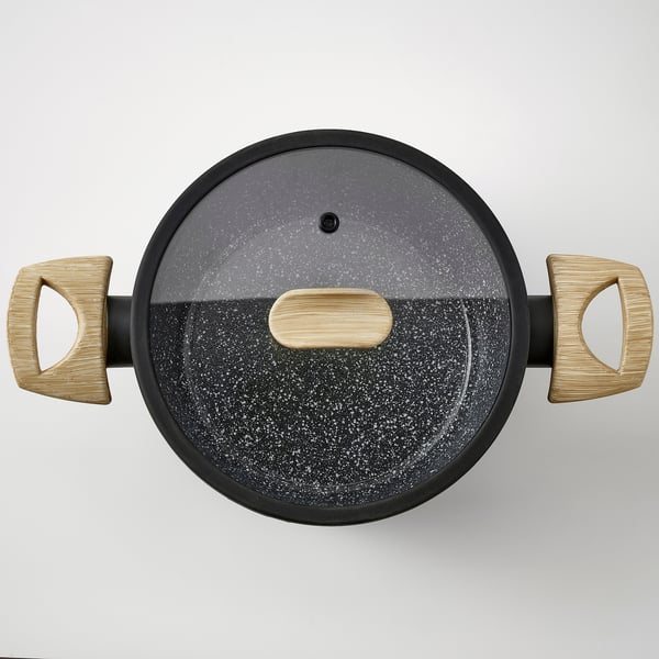 Top-view of a black pan with wooden handles and a tempered glass lid, showcasing its high-quality non-stick interior and comfortable grip.