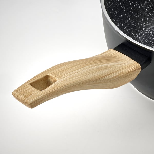 Wooden handle attached to black pan, showcasing high-quality design and grip.