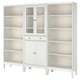 A white IDANÄS furniture set with glass doors and shelves, combining classic design with modern functionality.
