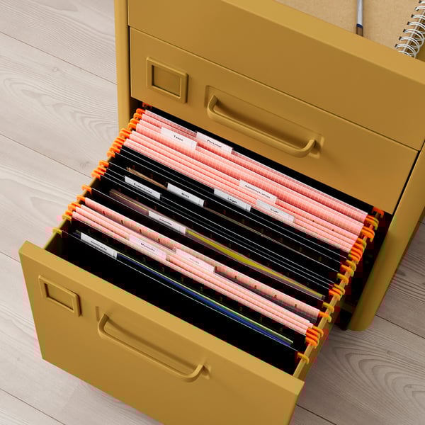 Open yellow filing cabinet with multiple color-coded folders, each labelled for different categories, featuring integrated dampers for smooth closure.
