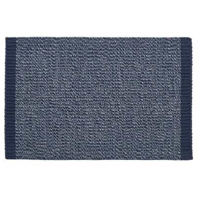 Rectangular, dark blue woven cotton door mat with white accents, designed to withstand heavy traffic, machine washable.