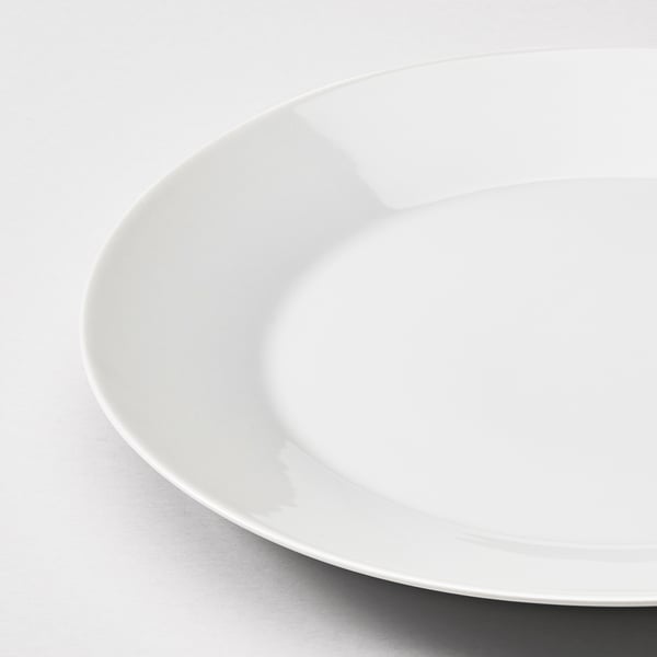 Clean, pristine white porcelain plate, gleaming in high-quality finish.