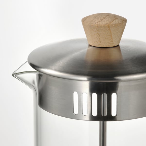 Stainless steel kettle with bamboo handle, bright and clean.