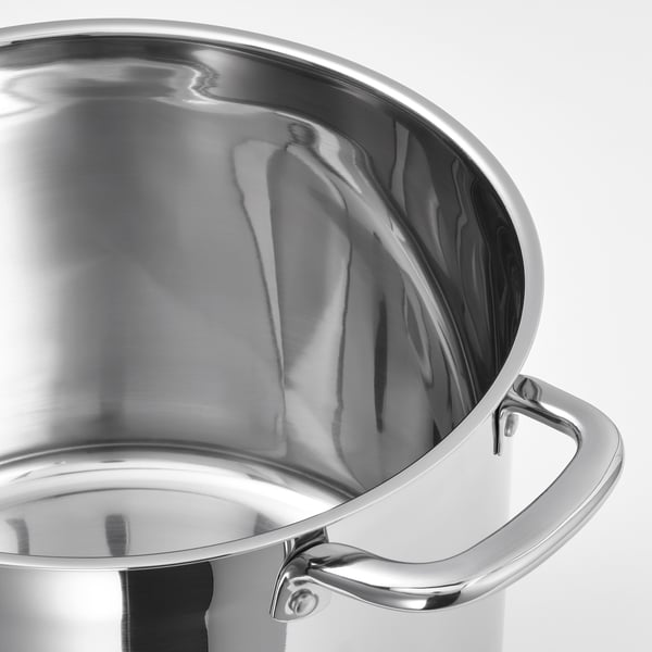 Silver saucepan with dual handles on a white background. Mirrors light, suggesting high-quality stainless steel finish.