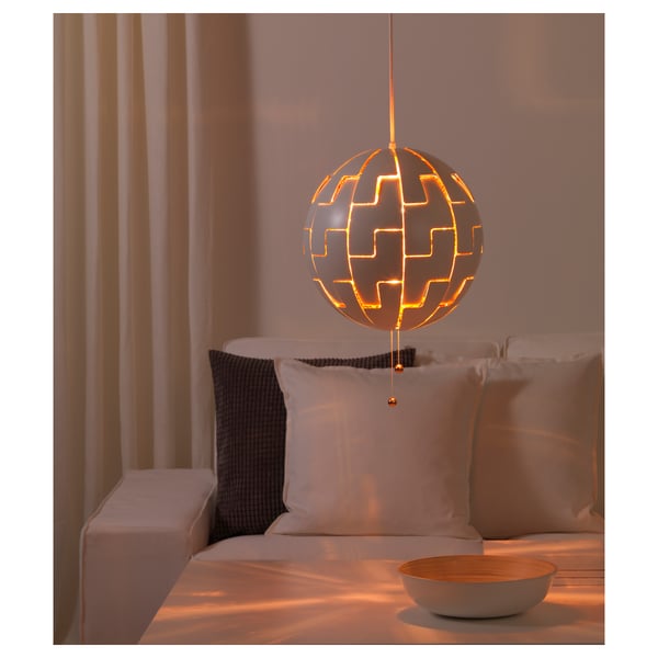 Unique hanging lamp casts warm patterns. Adjust light intensity by pulling strings.