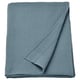 An INDIRA blue cotton bedspread, folded neatly, with a textured weave, offering warmth and comfort.