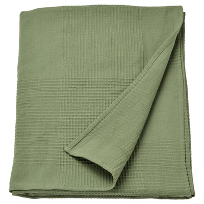 Folded green cotton INDIRA bed spread, recycled content.