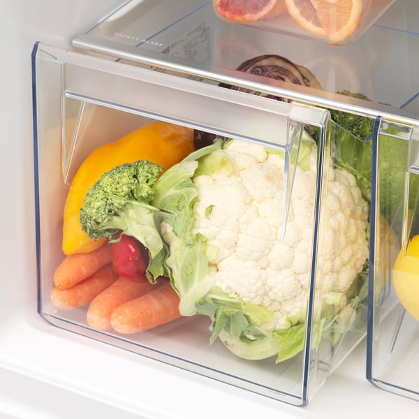 Fridge with adjustable glass shelves, inbuilt fan, and led light. Vegetables stored in clear plastic box.