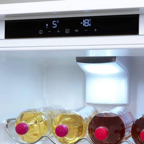 Modern fridge with led light, digital temperature display, and clear storage.