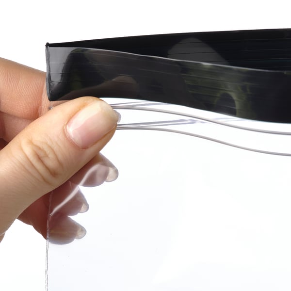 Hand holding transparent reusable bag, demonstrating its resealable function with visible double seal.