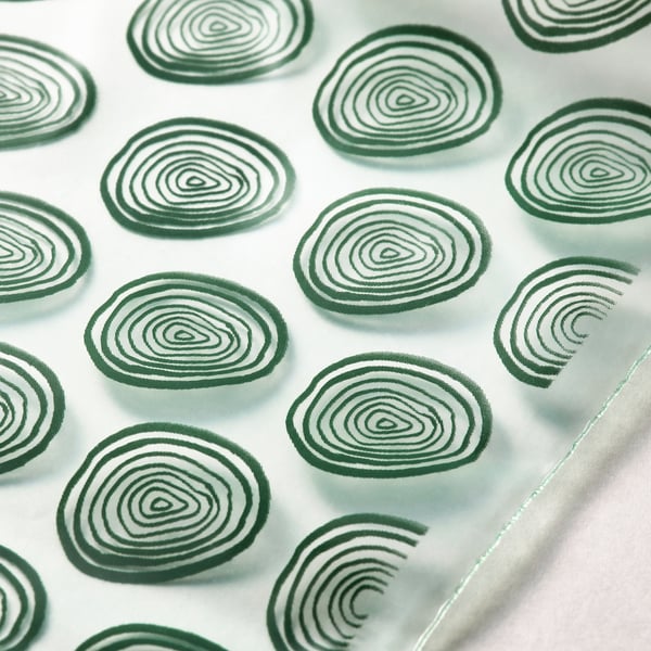 Fresh, reusable greens-patterned bags with secure seals, ideal for food storage.