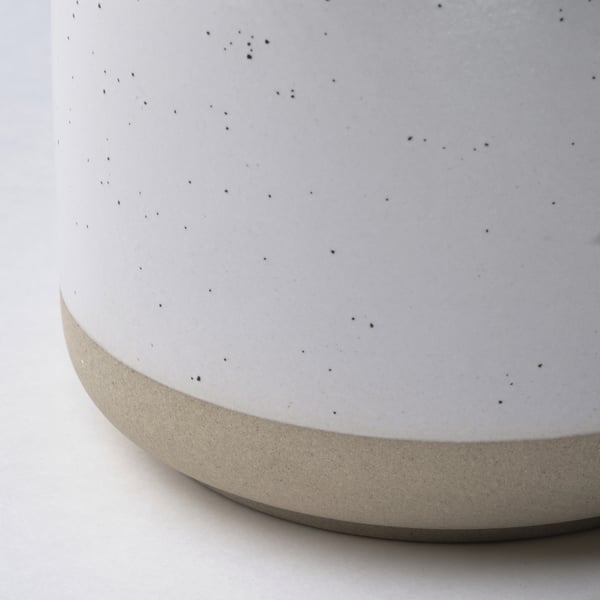 White candle jar, speckled glaze.