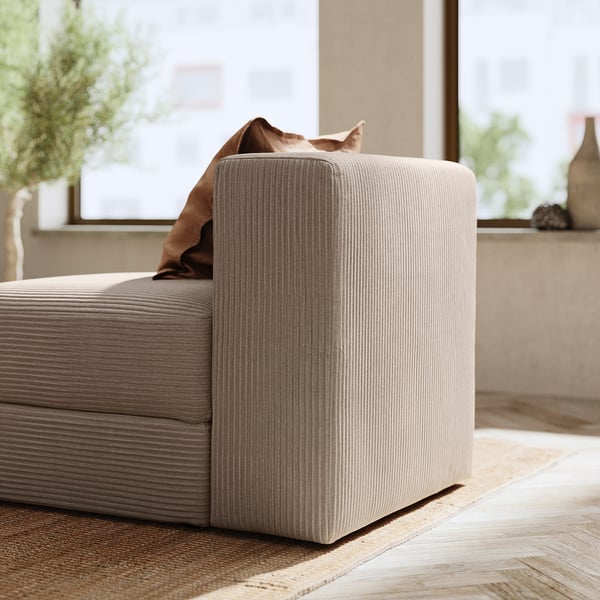 Modern beige modular sofa corner with cushions, soft texture, and clean lines. Perfect for comfort and style.