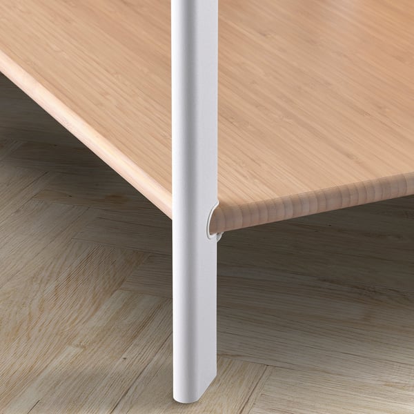 JÄTTESTA table corner, light wood & white metal, sleek, rounded edges.