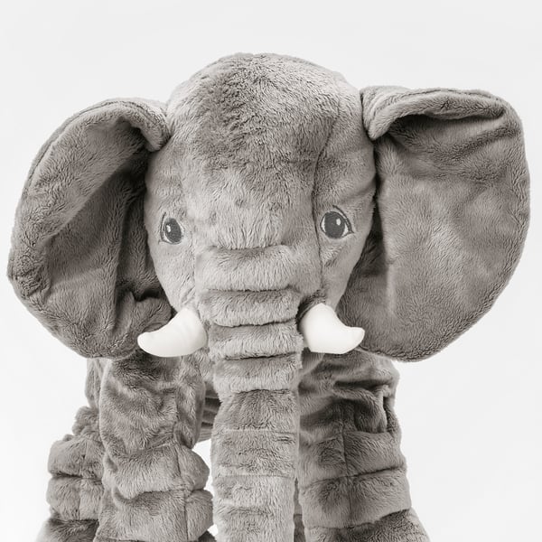 Large stuffed elephant toy, soft plush fabric, detailed tusks, and large ears. Ideal for comfort and play.