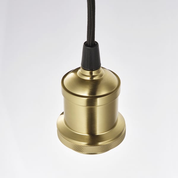 Golden metal lamp fixture with textured base, attached to black cord and connector.